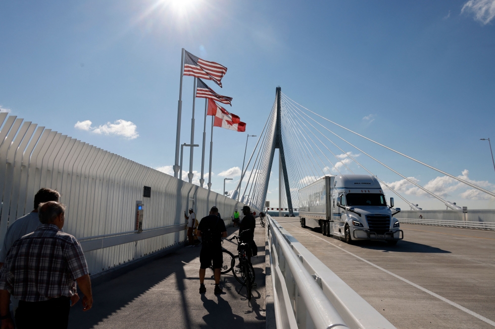 Trump bans Canadian alcohol and targets wider range of goods in escalating trade war